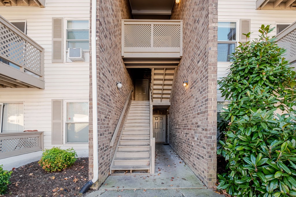 A building with a staircase leading to the second floor.