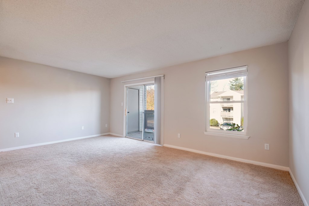 Empty room with a door and a window.