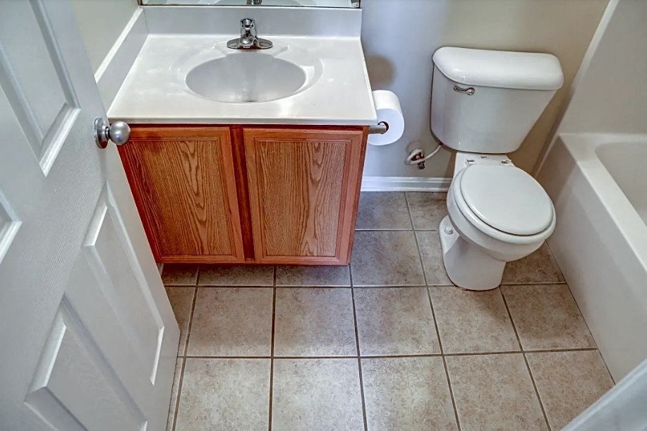 a bathroom with a toilet and a sink