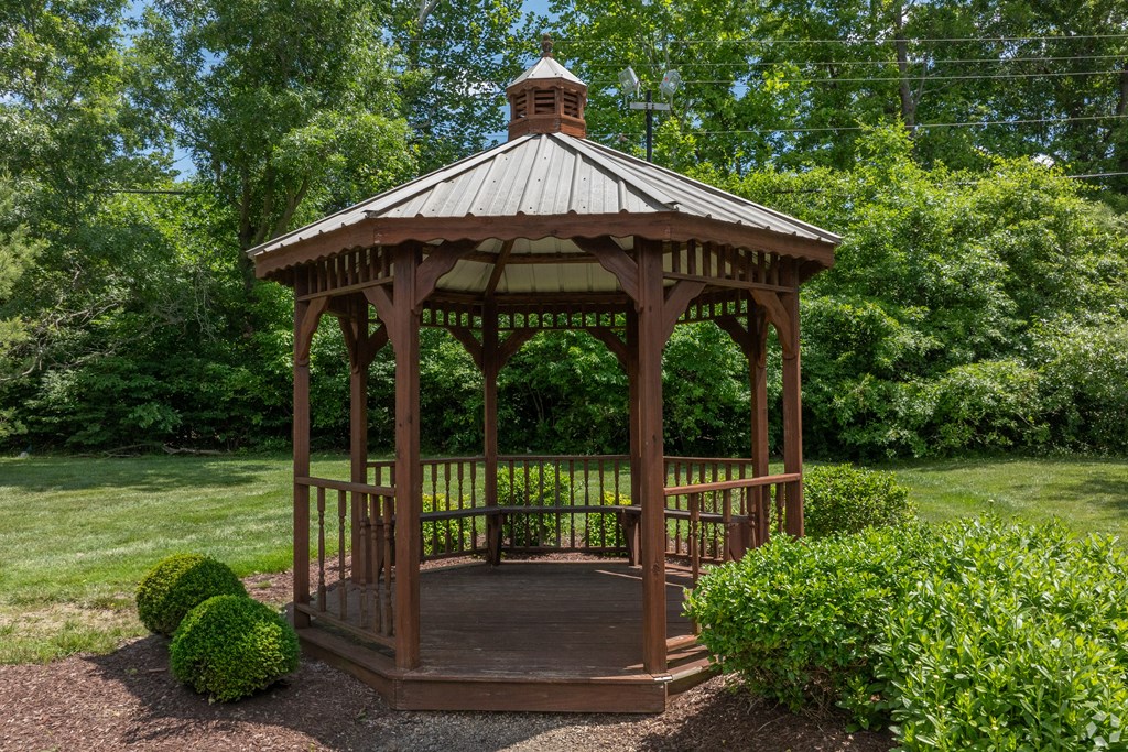 a gazebo in the middle of a garden