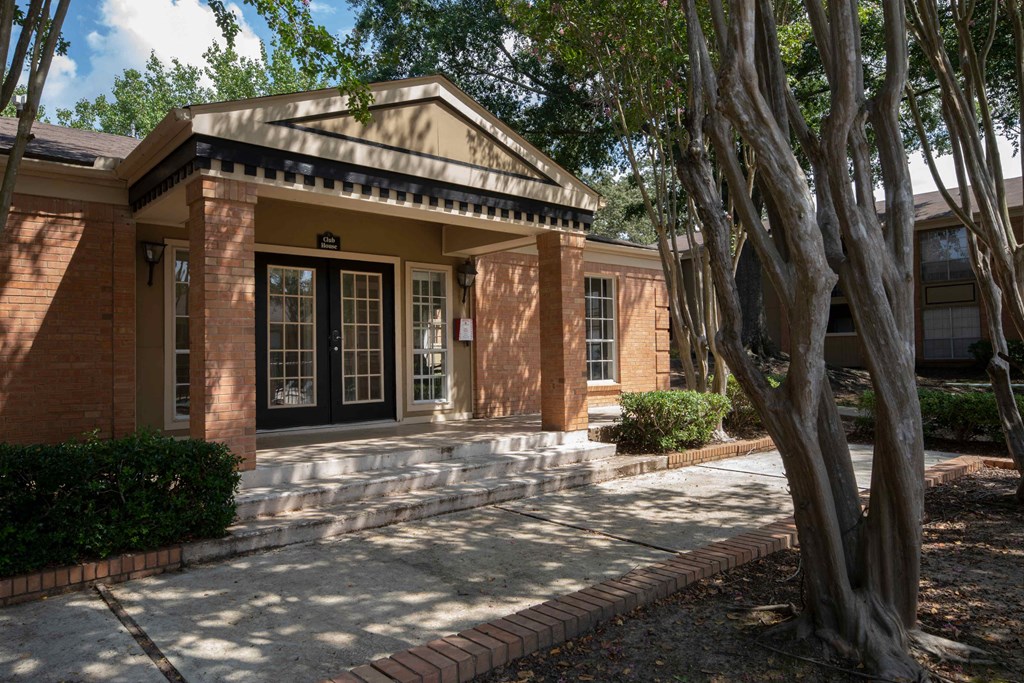 a house with a large tree in front of it