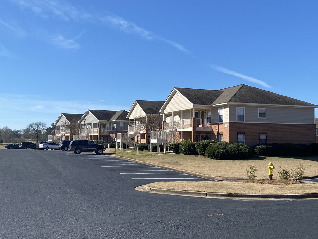 a row of houses on the side of a street