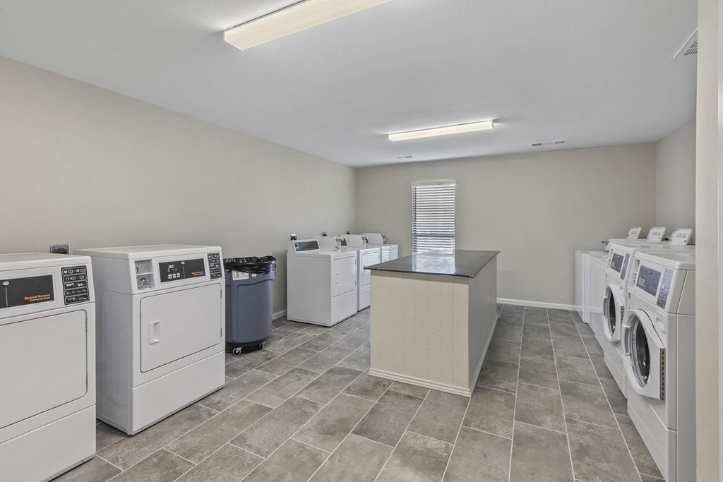 the laundry room at the preserve at green valley falls apartments