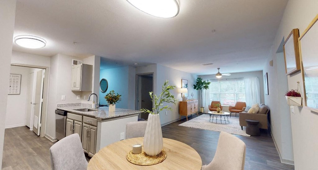 a kitchen and living room in an apartment