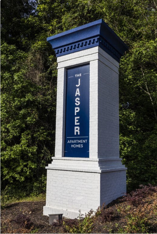 a column with a blue sign on top of it