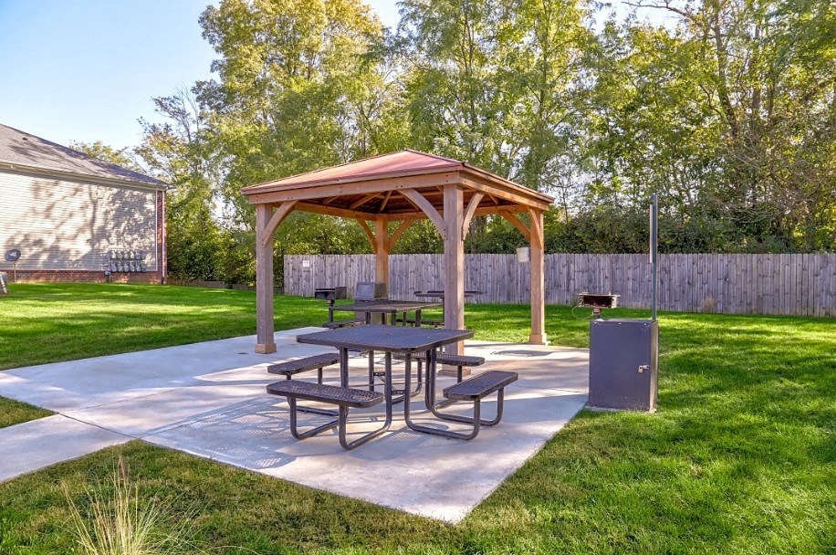 a picnic area with a picnic table and a pavilion