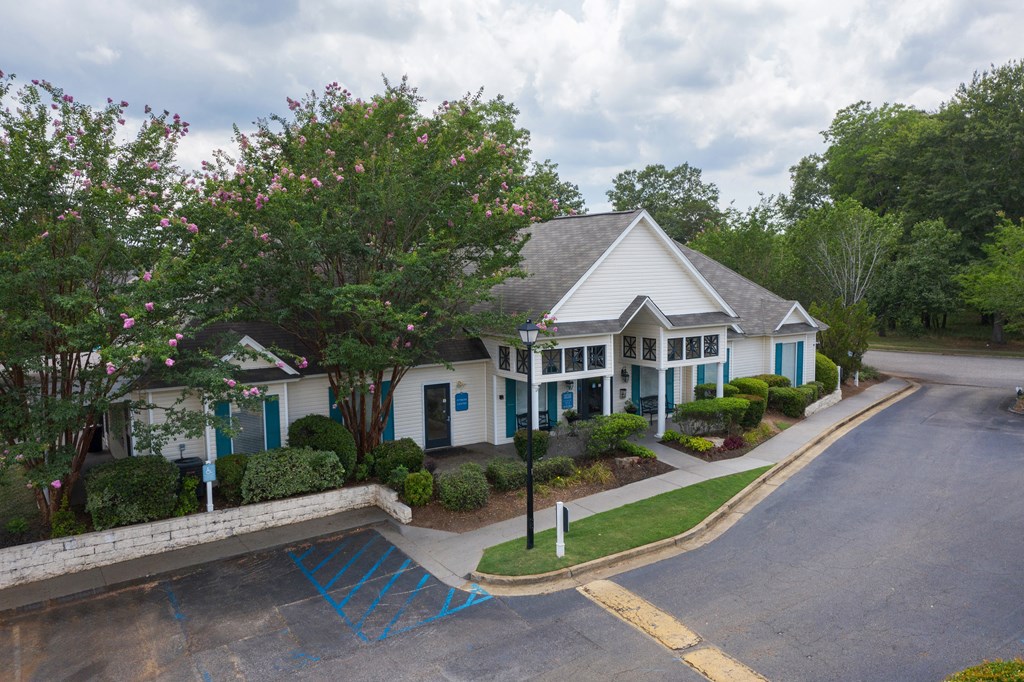 a house with blue shutters and a gray roof