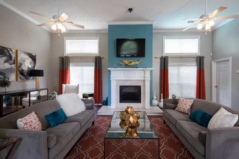 a living room with two couches and a fireplace