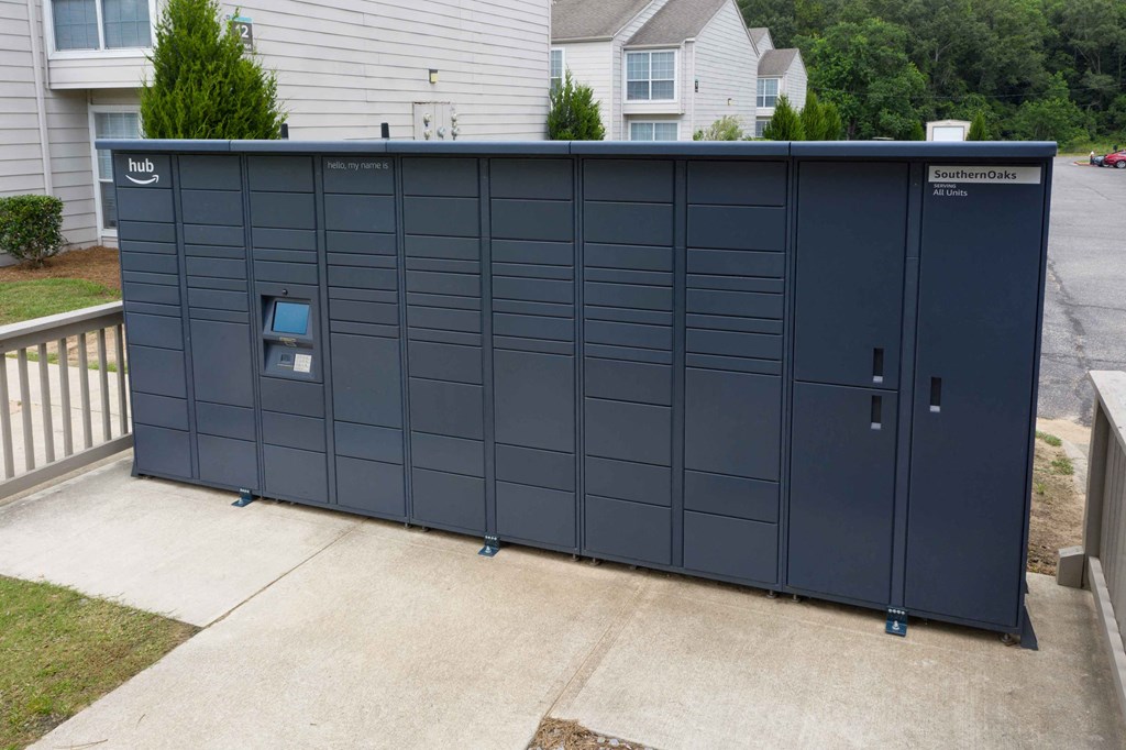 a large gray metal garage with a small window in the door