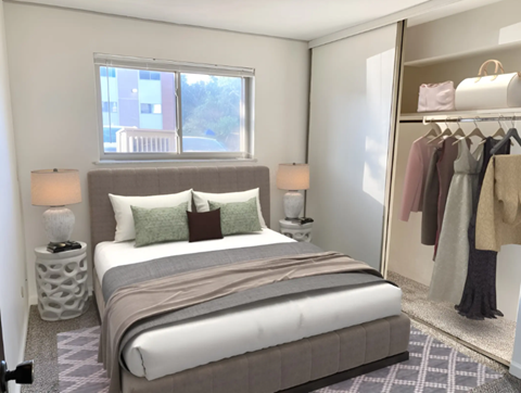 A bedroom with a large bed and a wardrobe.