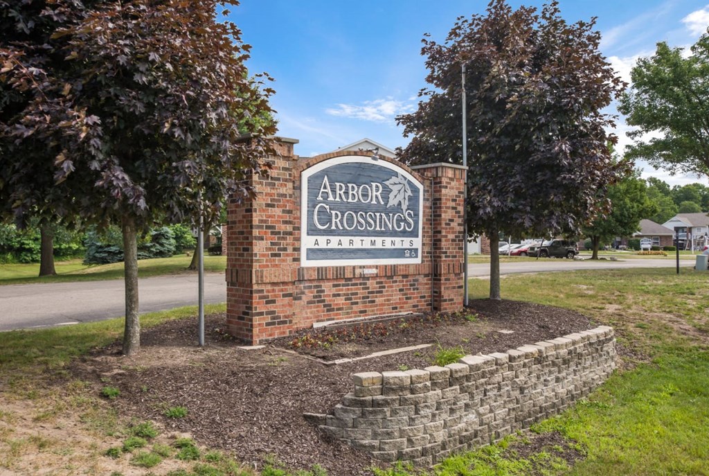 the sign for arbor crossings on the side of a road