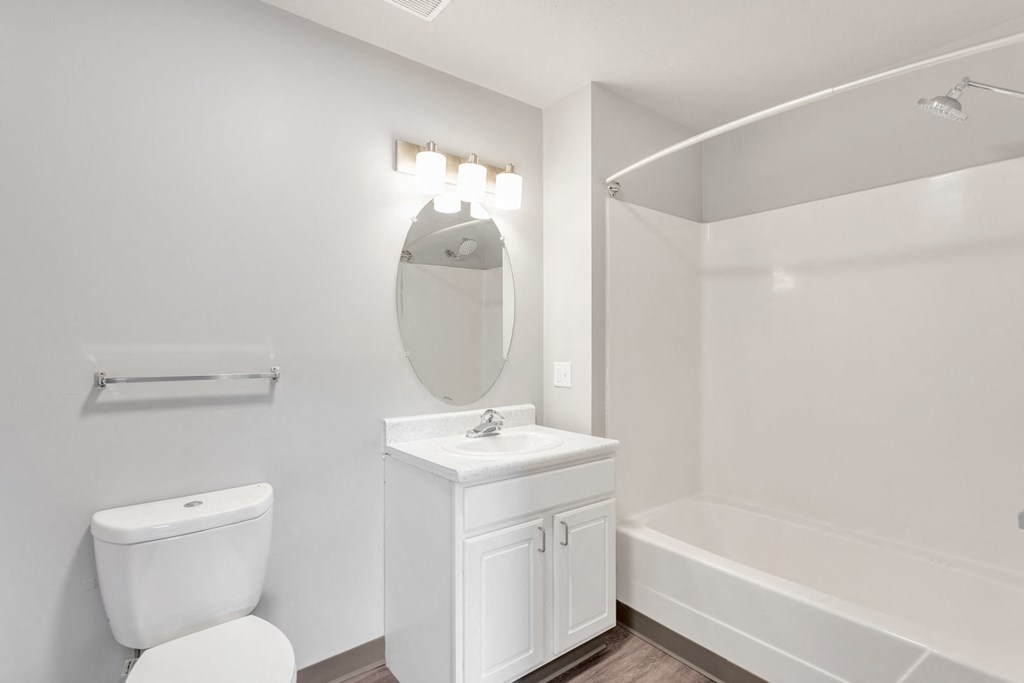 a bathroom with a sink toilet and a bath tub