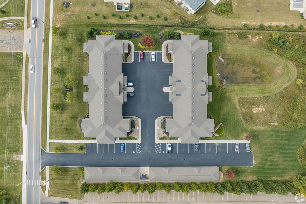 an aerial view of a parking lot at an airport