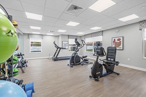 Salem Village Fitness Room with treadmill and exercise bike