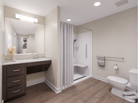 A bathroom with a white toilet and a walk-in shower. at Evergreen Heights Apartments, Toledo, 43614