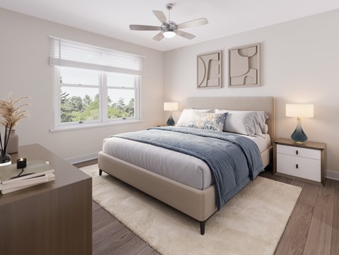 A bedroom with a large bed and a ceiling fan. at Evergreen Heights Apartments, Ohio