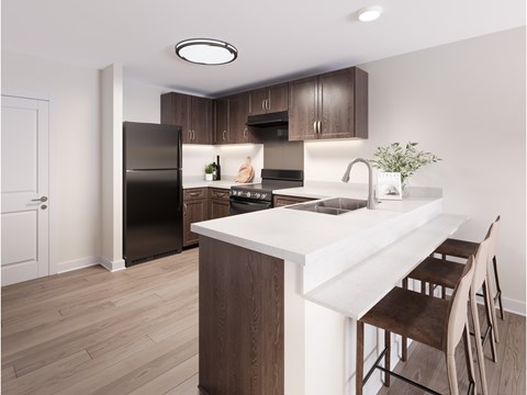 A kitchen with a black refrigerator and brown chairs. at Evergreen Heights Apartments, Ohio, 43614