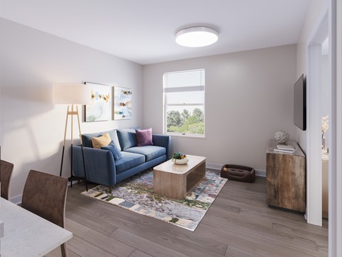 A living room with a blue couch, a wooden coffee table, and a television. at Evergreen Heights Apartments, Ohio, 43614