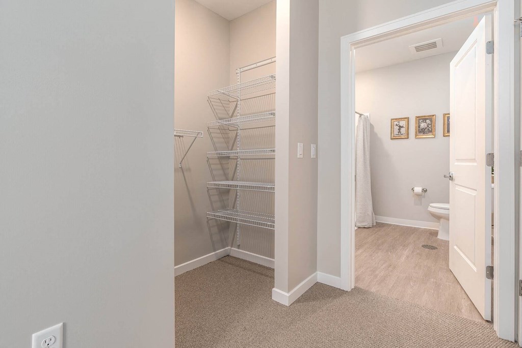 A white door is open to a bathroom.