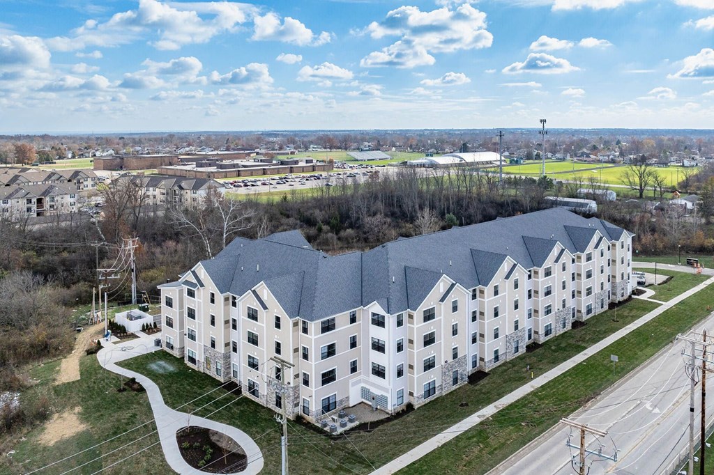 A large white building with a curved walkway in front of it.
