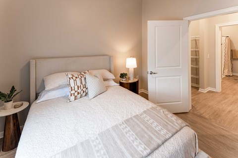 Bedroom with wood style flooring and attached bathroom at Collingwood Green Living Apartments, Toledo, 43604