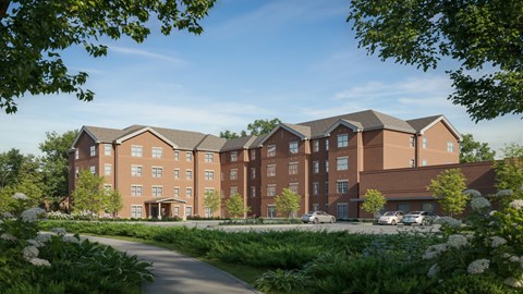 A large, modern building with a brown facade and a driveway in front. at Evergreen Heights Apartments, Toledo