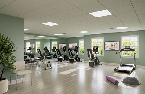 A gym with treadmills, exercise bikes, and other equipment.