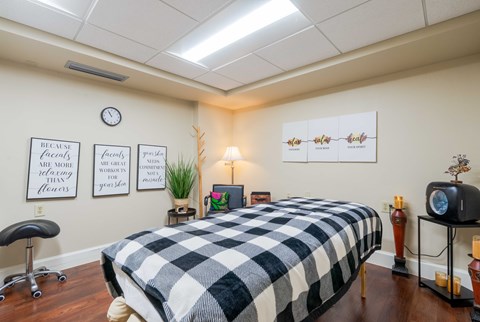 Massage therapy room with treatment table at Landings of St. Andrew Apartments, Florida, 34652
