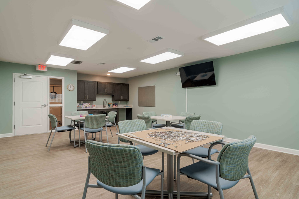 A room with a table and chairs in it at Sweetwater Point in Douglasville, GA