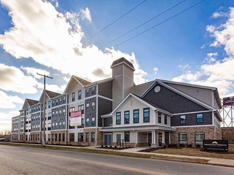 A large building with a sign that says "The Inn at Penn" in front of it.