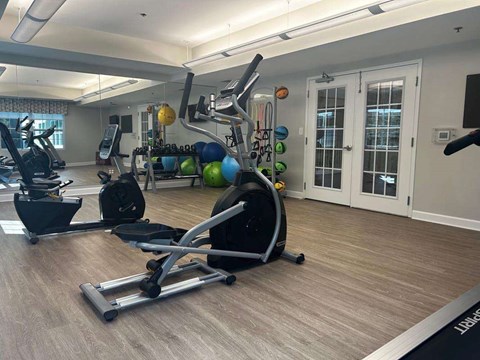 A home gym with a variety of exercise equipment.