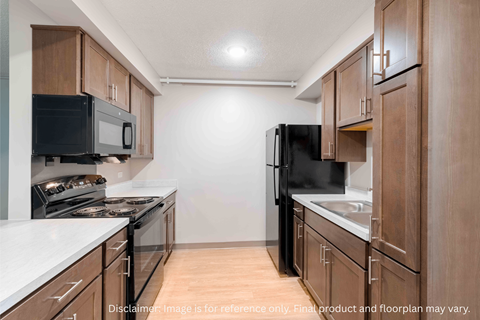 A kitchen with black appliances and wooden cabinets.