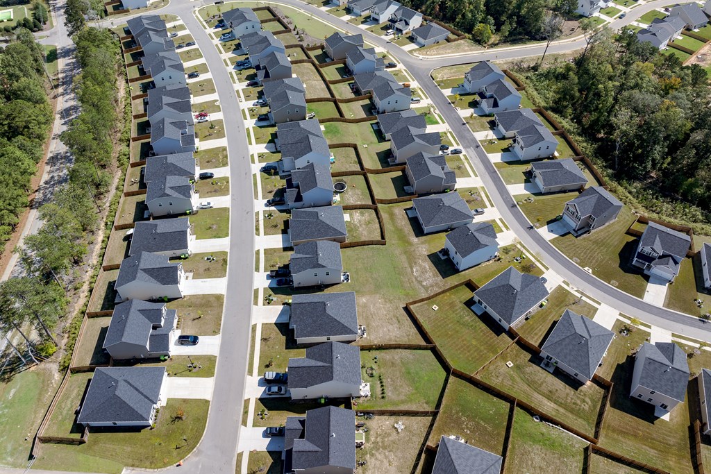 an aerial view of a row of houses in a suburb