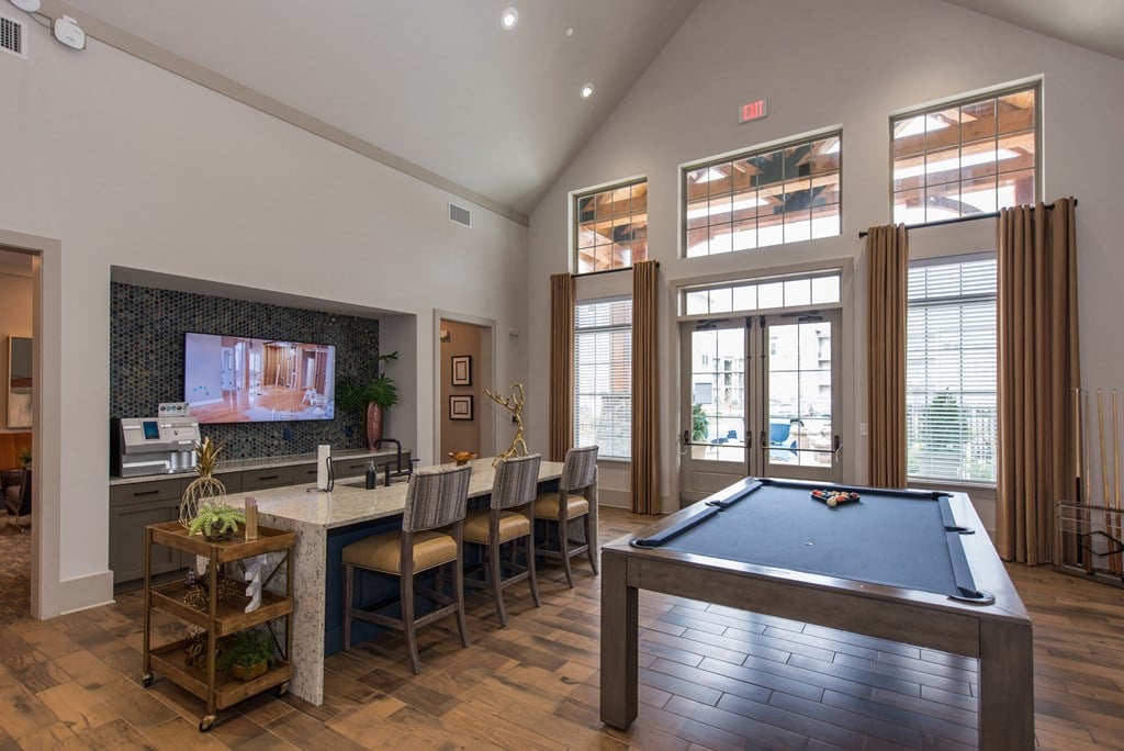 take a break in the resident clubhouse with a pool table and flat screen tv at The Whitworth, Williamsburg, 23185