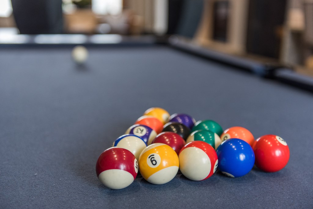 a pile of pool balls on a pool table at The Whitworth, Virginia, 23185