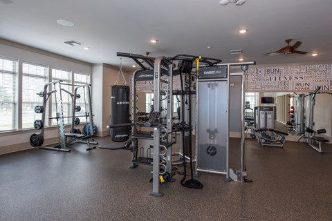 a fitness room with a lot of exercise equipment at The Whitworth, Williamsburg, 23185