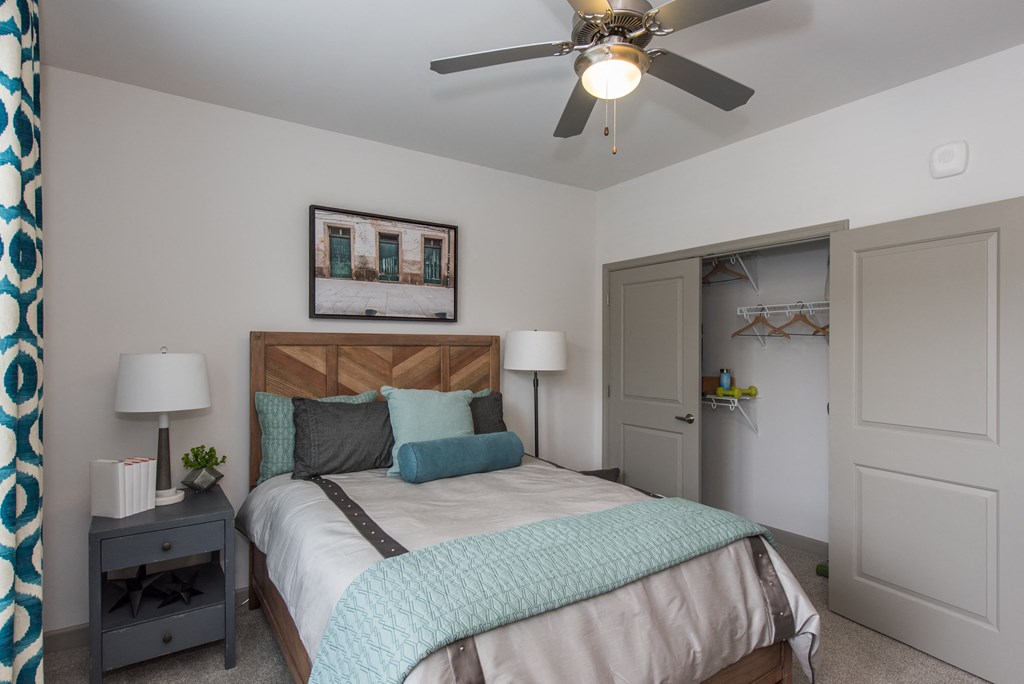 a bedroom with a bed and a ceiling fan at The Whitworth, Williamsburg, 23185