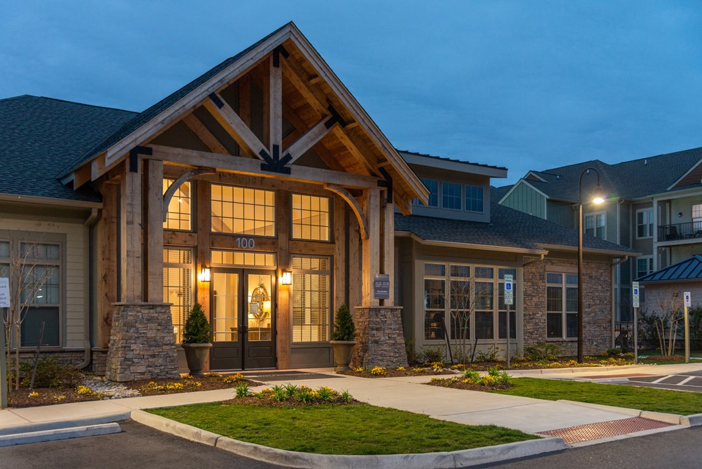 a home with large windows and a large wooden beam on the front of it at The Whitworth, Williamsburg, VA, 23185
