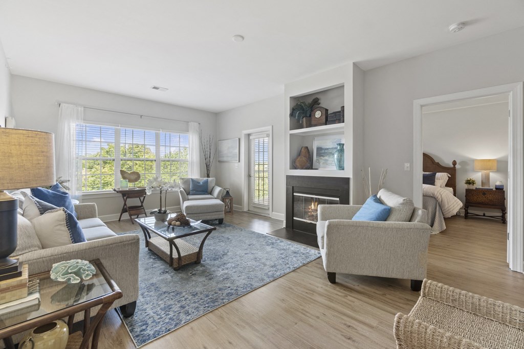 A living room with a fireplace and a couch at Saltmeadow Bay, Virginia Beach, 23451