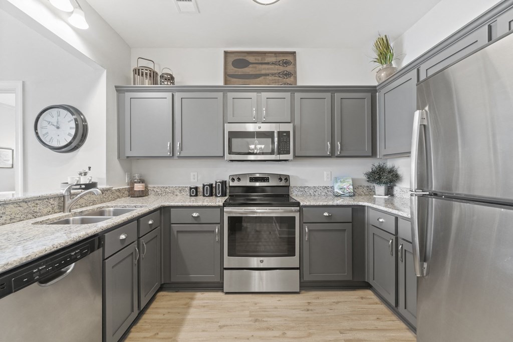 A kitchen with a stainless steel refrigerator and a stove with an oven at Saltmeadow Bay, Virginia Beach, VA, 23451