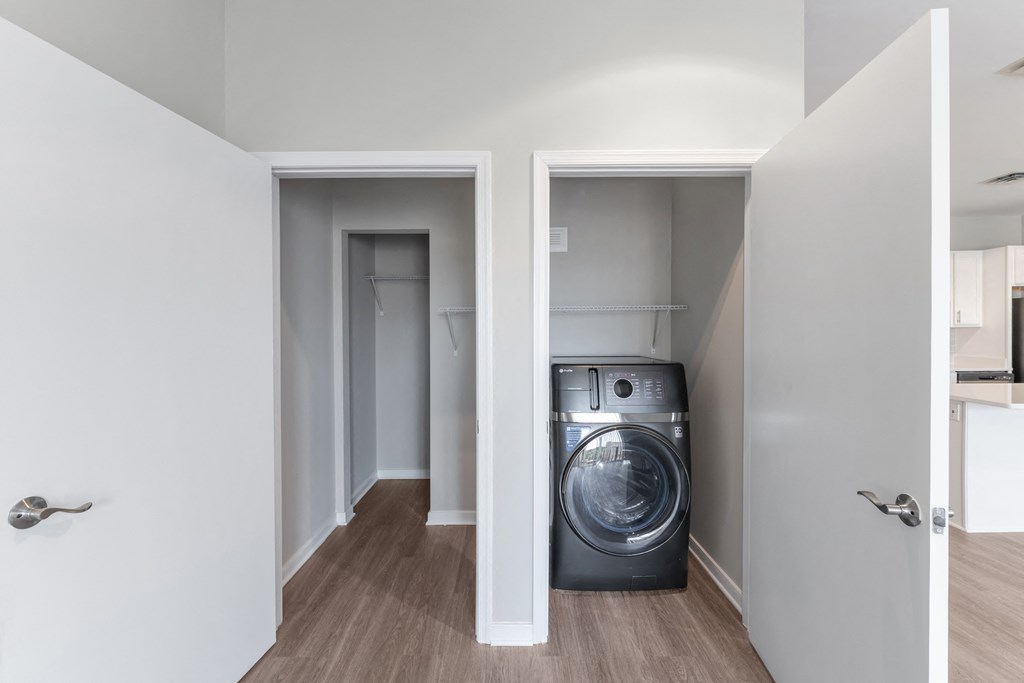a washer and dryer in a small room in a house