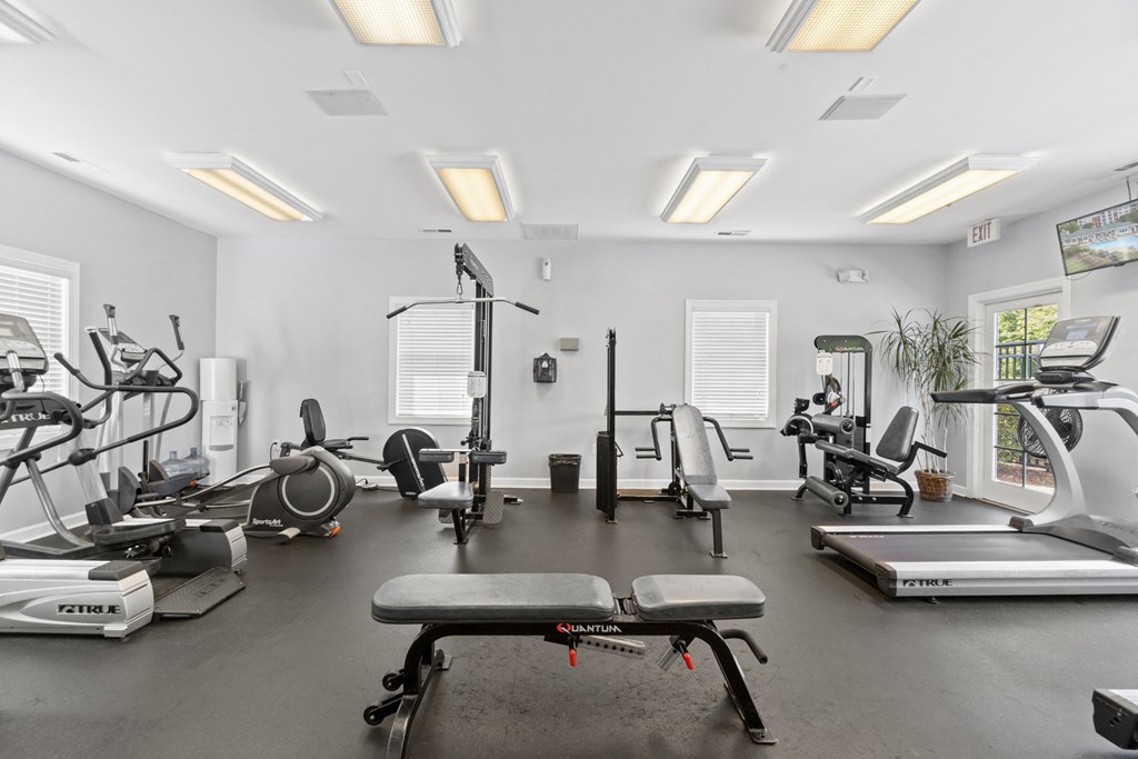 a gym with treadmills and other exercise equipment and windows at Saltmeadow Bay, Virginia Beach, VA, 23451