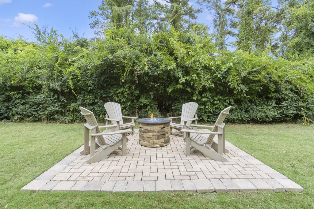 a backyard with a patio with chairs and a fire pit at Saltmeadow Bay, Virginia Beach, Virginia