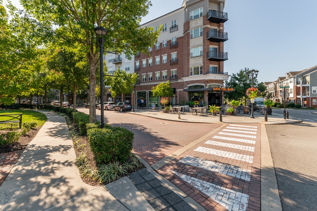 a city street with a building and a crosswalk