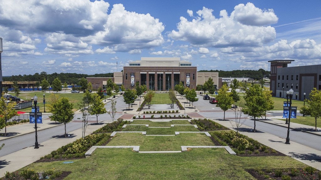 A large building with a long walkway in front of it