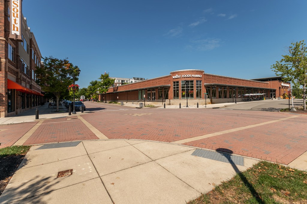 a large brick building on the corner of a street