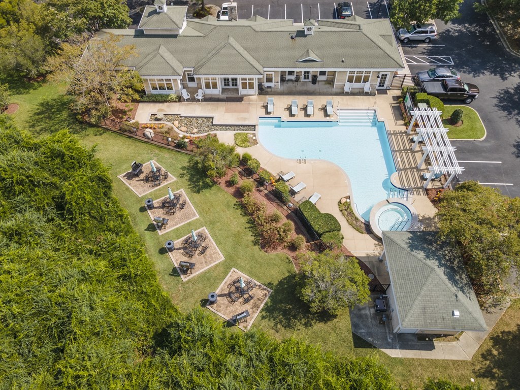 an aerial view of a swimming pool and a house with a yard and a lawn at Saltmeadow Bay, Virginia Beach, VA