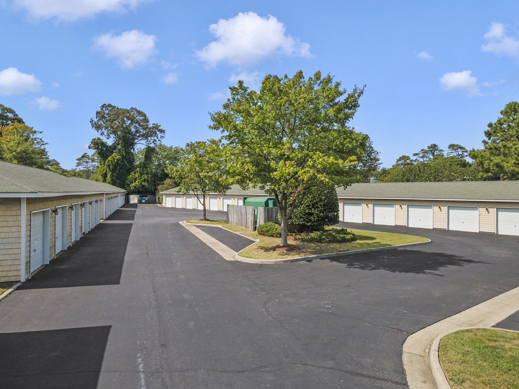 a parking lot with garages on both sides of a street at Saltmeadow Bay, Virginia Beach, 23451