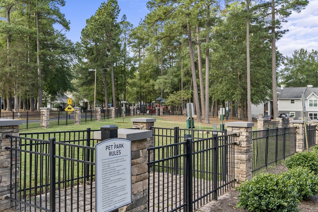 a cemetery with a fence and a sign in front of it at Trails at Short Pump Apartments, Richmond, VA, 23233