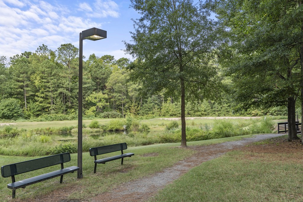 two park benches next to a path in a park at Trails at Short Pump Apartments, Richmond, VA, 23233
